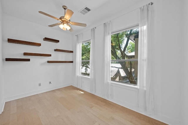 2216 Thornton Rd Unit 221, Austin, TX 78704 - unfurnished room with light wood finished floors, ceiling fan, and baseboards