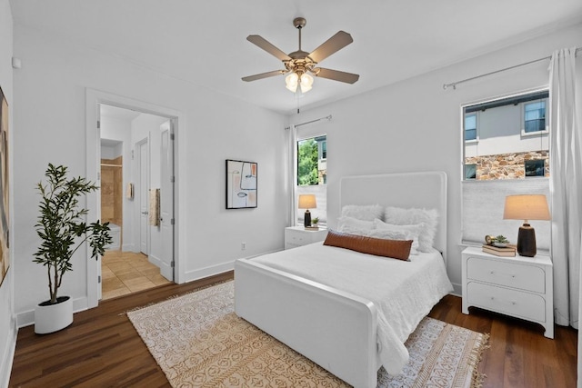 2216 Thornton Rd Unit 221, Austin, TX 78704 - bedroom with wood finished floors, ceiling fan, ensuite bathroom, and baseboards