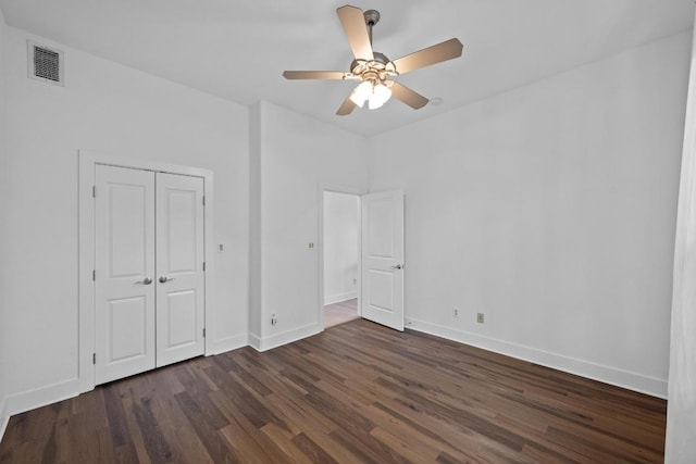 2216 Thornton Rd Unit 221, Austin, TX 78704 - unfurnished bedroom with dark wood-style flooring, baseboards, and a closet