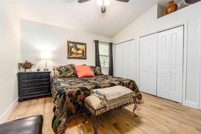1135 Barton Hills Dr Unit 160, Austin, TX 78704 - bedroom featuring light wood finished floors, vaulted ceiling, two closets, baseboards, and a ceiling fan