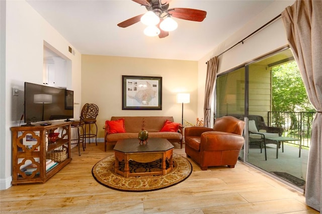 1135 Barton Hills Dr Unit 160, Austin, TX 78704 - living room with light wood-style floors, ceiling fan, and baseboards
