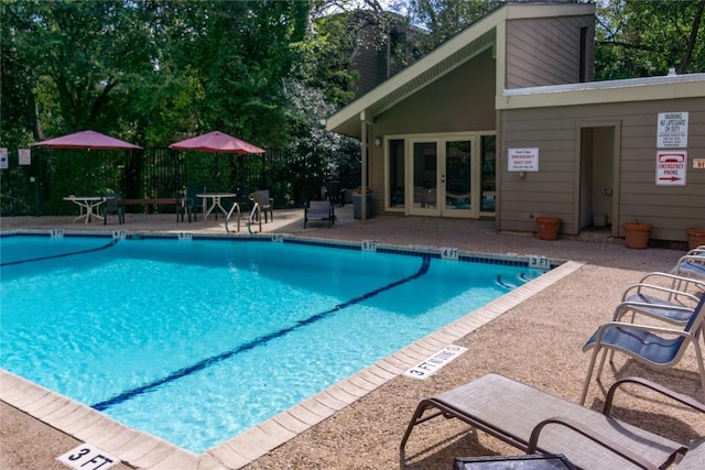 1135 Barton Hills Dr Unit 160, Austin, TX 78704 - community pool with french doors and a patio