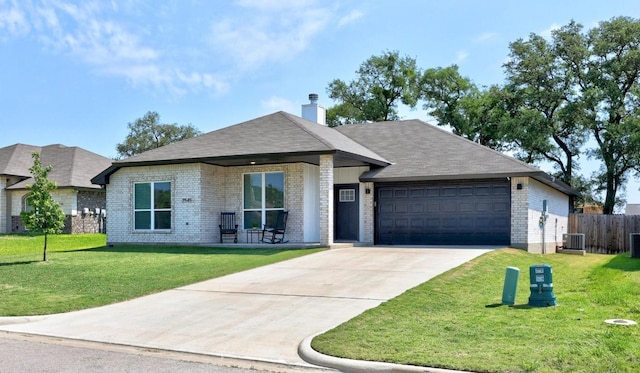2545 Belle Hubbard Trl, Belton, TX 76513 - ranch-style house with an attached garage, brick siding, driveway, central air condition unit, and a chimney