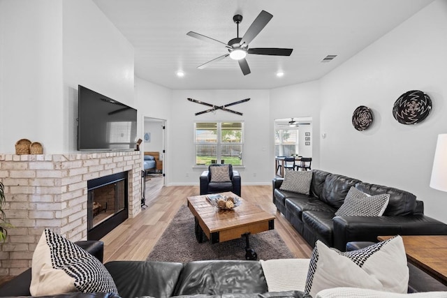 2545 Belle Hubbard Trl, Belton, TX 76513 - living room with a ceiling fan, light wood-type flooring, a brick fireplace, and recessed lighting