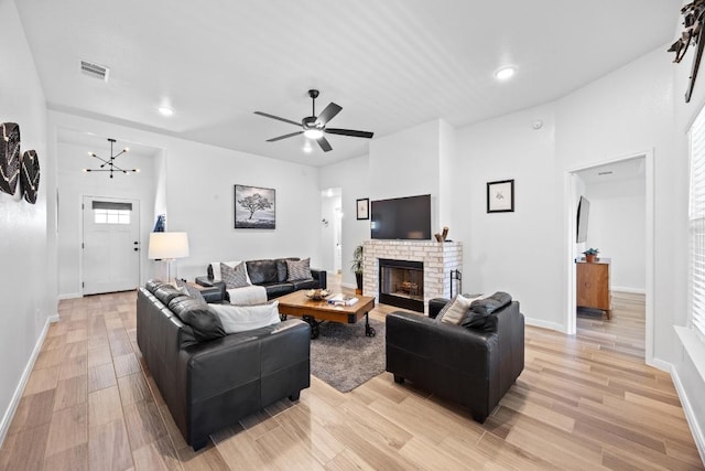 2545 Belle Hubbard Trl, Belton, TX 76513 - living area featuring light wood-style flooring, baseboards, a fireplace, a ceiling fan, and recessed lighting