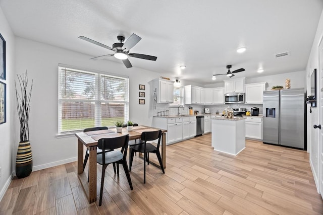 2545 Belle Hubbard Trl, Belton, TX 76513 - dining space featuring ceiling fan, light wood-type flooring, and baseboards