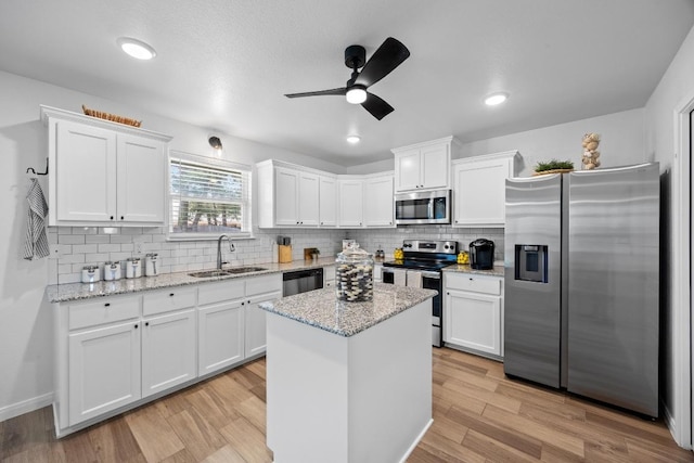 2545 Belle Hubbard Trl, Belton, TX 76513 - kitchen with appliances with stainless steel finishes, a sink, white cabinets, and recessed lighting