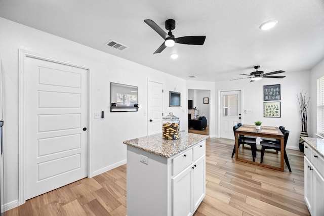 2545 Belle Hubbard Trl, Belton, TX 76513 - kitchen with ceiling fan, light wood-style flooring, a center island, and recessed lighting