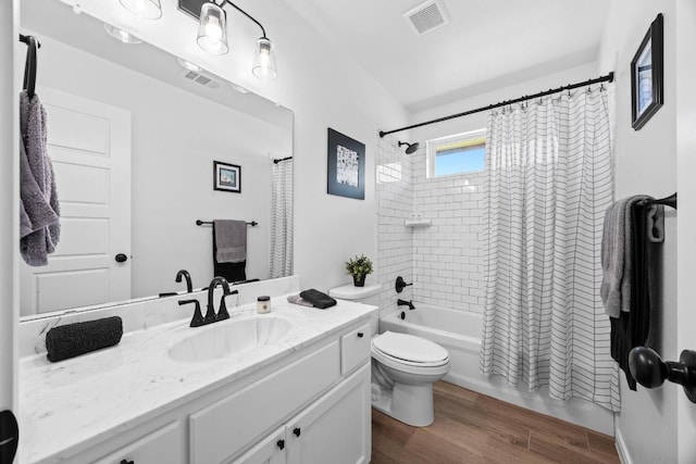 2545 Belle Hubbard Trl, Belton, TX 76513 - full bath featuring vanity, toilet, shower / tub combo, and wood finished floors