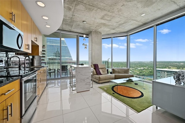360 Nueces St Unit 3602, Austin, TX 78701 - living room featuring expansive windows and light tile patterned flooring