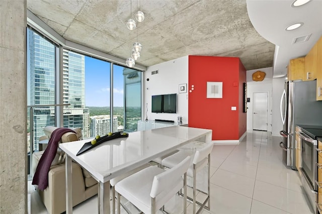 360 Nueces St Unit 3602, Austin, TX 78701 - dining room featuring light tile patterned floors and baseboards