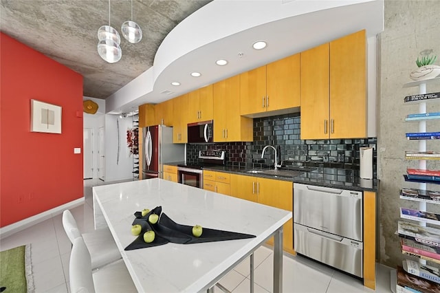 360 Nueces St Unit 3602, Austin, TX 78701 - kitchen with stainless steel appliances, a sink, light tile patterned flooring, hanging light fixtures, and recessed lighting