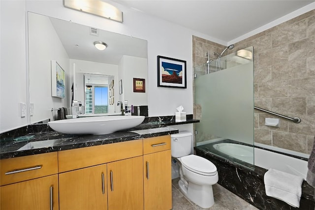 360 Nueces St Unit 3602, Austin, TX 78701 - bathroom with vanity, a combined bath / shower with marble appearance, tile patterned flooring, and toilet