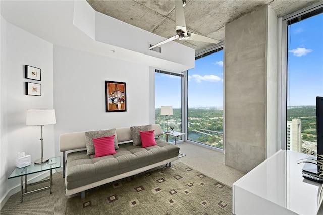 360 Nueces St Unit 3602, Austin, TX 78701 - living area with a wall of windows, carpet flooring, and a ceiling fan