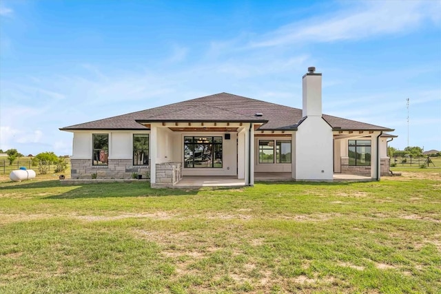 178 Balch Rd, Elgin, TX 78621 - back of house with a patio area, roof with shingles, a chimney, stucco siding, and stone siding