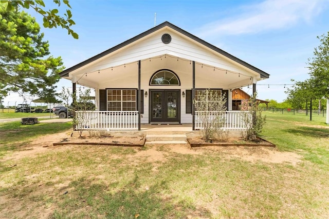 178 Balch Rd, Elgin, TX 78621 - view of front of home featuring covered porch, a front lawn, and french doors