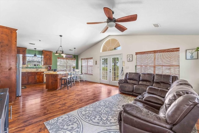 178 Balch Rd, Elgin, TX 78621 - living area with dark wood finished floors, vaulted ceiling, a ceiling fan, and french doors