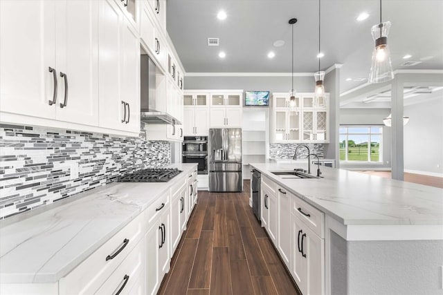 178 Balch Rd, Elgin, TX 78621 - kitchen with stainless steel appliances, a sink, dark wood-type flooring, a large island, and wall chimney exhaust hood