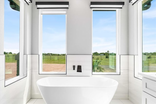 178 Balch Rd, Elgin, TX 78621 - bathroom with a freestanding bath, vanity, and tile patterned flooring