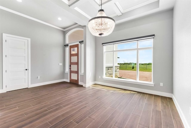 178 Balch Rd, Elgin, TX 78621 - spare room featuring a chandelier, dark wood finished floors, ornamental molding, baseboards, and beam ceiling
