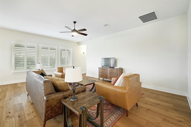 192 Call Dr, Austin, TX 78737 - living area with light wood finished floors, a ceiling fan, and baseboards