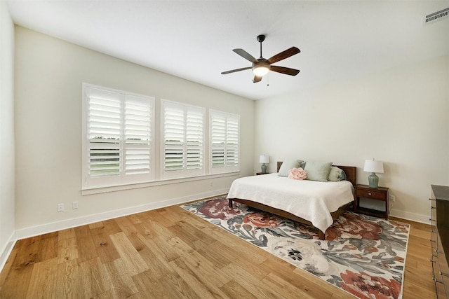 192 Call Dr, Austin, TX 78737 - bedroom with wood finished floors, baseboards, and a ceiling fan