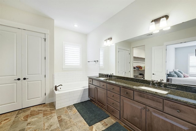192 Call Dr, Austin, TX 78737 - ensuite bathroom with a garden tub and double vanity