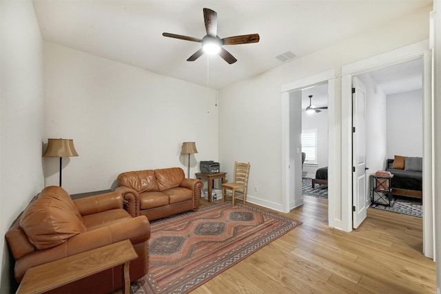 192 Call Dr, Austin, TX 78737 - living area featuring ceiling fan, light wood-type flooring, and baseboards