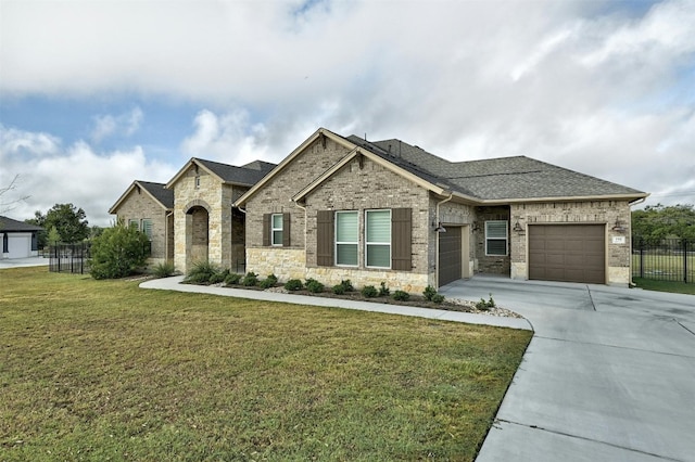 192 Call Dr, Austin, TX 78737 - french provincial home with concrete driveway, a garage, a shingled roof, brick siding, and stone siding