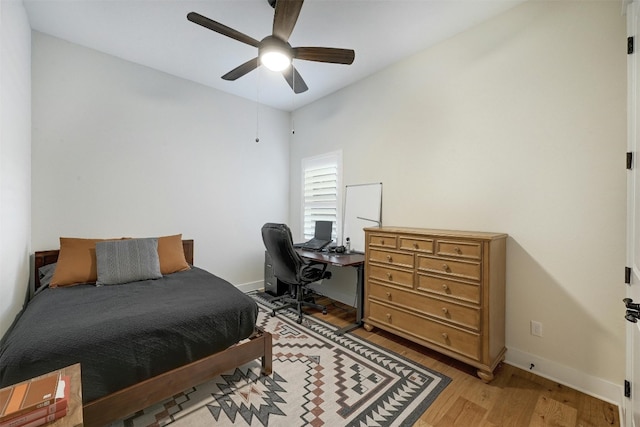 192 Call Dr, Austin, TX 78737 - bedroom featuring light wood-style floors, a desk, baseboards, and a ceiling fan
