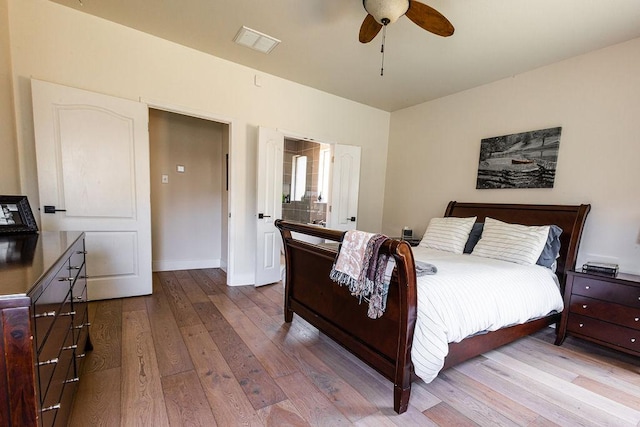 110 Saint Richie Ln, Austin, TX 78737 - bedroom with hardwood / wood-style floors, baseboards, and ceiling fan