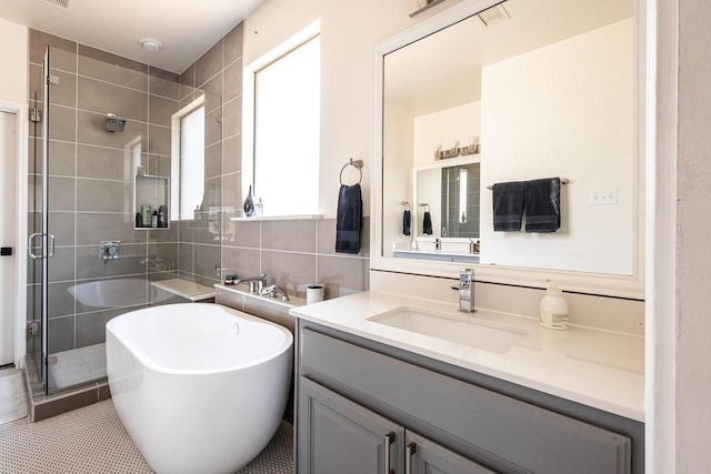 110 Saint Richie Ln, Austin, TX 78737 - bathroom with vanity, a shower stall, and a soaking tub