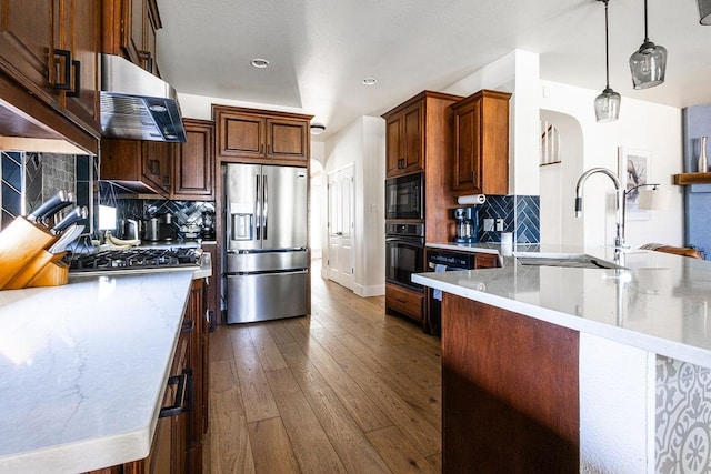 110 Saint Richie Ln, Austin, TX 78737 - kitchen featuring black appliances, dark wood-type flooring, backsplash, a sink, and pendant lighting