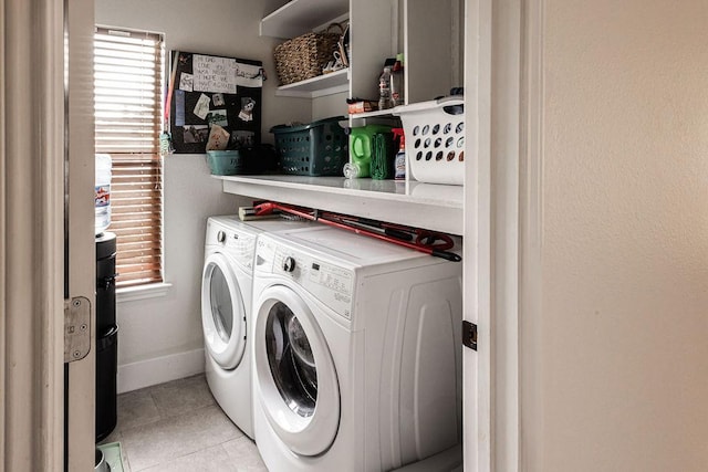 110 Saint Richie Ln, Austin, TX 78737 - washroom featuring independent washer and dryer, light tile patterned floors, and baseboards