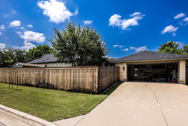110 Saint Richie Ln, Austin, TX 78737 - view of side of property featuring stone siding, concrete driveway, and an attached garage