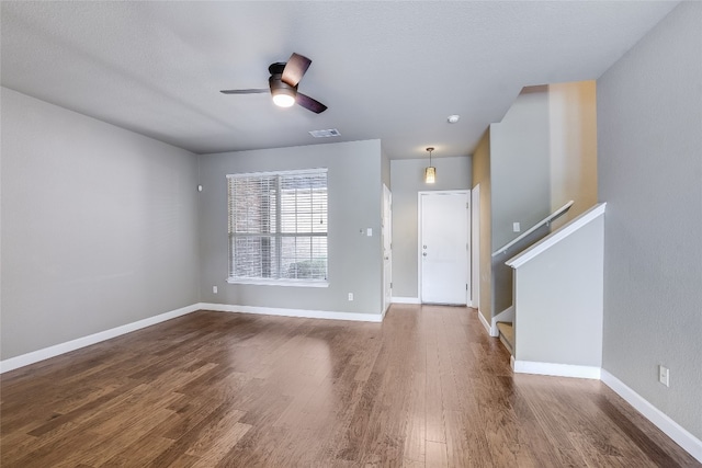 14 Verde Ranch Loop, Leander, TX 78641 - foyer featuring wood finished floors, ceiling fan, and stairs