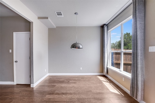 14 Verde Ranch Loop, Leander, TX 78641 - unfurnished dining area featuring wood finished floors