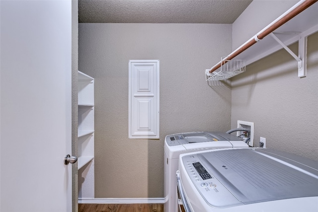 14 Verde Ranch Loop, Leander, TX 78641 - laundry area featuring separate washer and dryer, wood finished floors, and electric panel