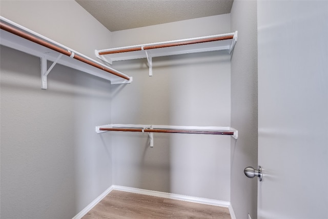 14 Verde Ranch Loop, Leander, TX 78641 - walk in closet featuring wood finished floors