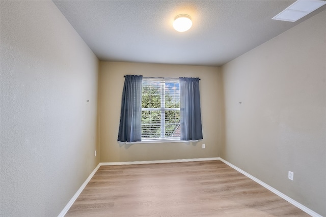 14 Verde Ranch Loop, Leander, TX 78641 - empty room with wood finished floors