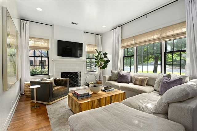 1712 Hartford Rd, Austin, TX 78703 - living room with wood finished floors, a fireplace, baseboards, and recessed lighting