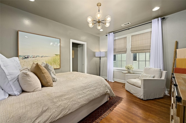 1712 Hartford Rd, Austin, TX 78703 - bedroom with a chandelier, wood finished floors, recessed lighting, and baseboards
