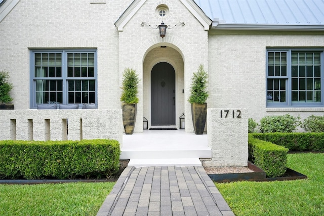 1712 Hartford Rd, Austin, TX 78703 - doorway to property with a standing seam roof, metal roof, and stucco siding