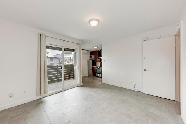 1840 Burton Dr Unit 102, Austin, TX 78741 - empty room with an AC wall unit and baseboards
