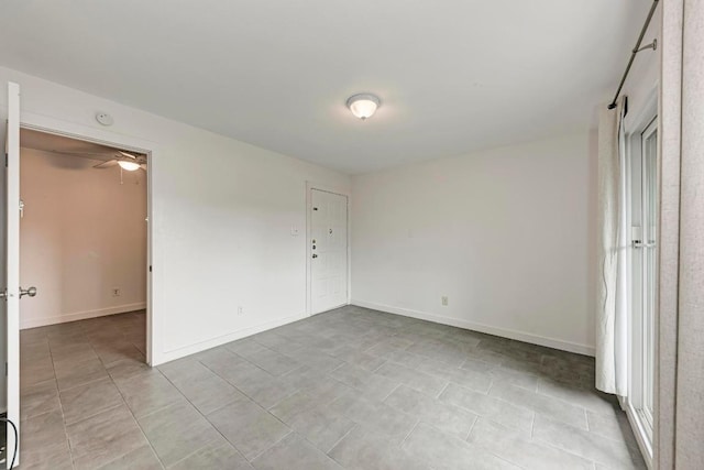 1840 Burton Dr Unit 102, Austin, TX 78741 - unfurnished bedroom featuring light tile patterned floors and baseboards