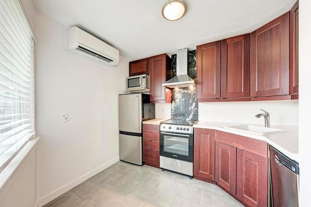 1840 Burton Dr Unit 102, Austin, TX 78741 - kitchen featuring appliances with stainless steel finishes, wall chimney exhaust hood, a wall mounted AC, a sink, and light countertops