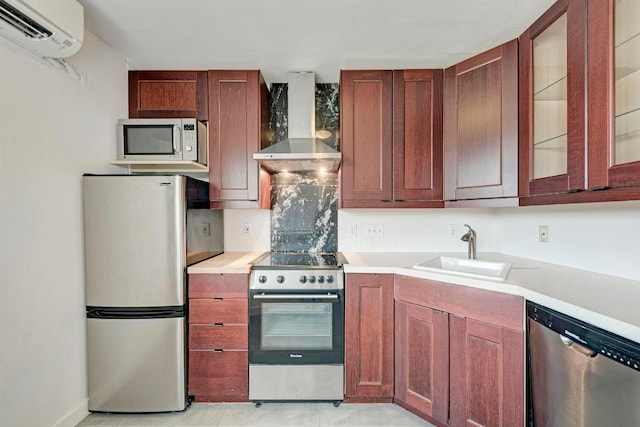 1840 Burton Dr Unit 102, Austin, TX 78741 - kitchen featuring stainless steel appliances, wall chimney exhaust hood, a sink, an AC wall unit, and light countertops