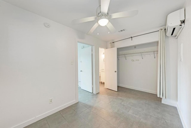 1840 Burton Dr Unit 102, Austin, TX 78741 - unfurnished bedroom with a wall mounted AC, a closet, ceiling fan, and light tile patterned flooring
