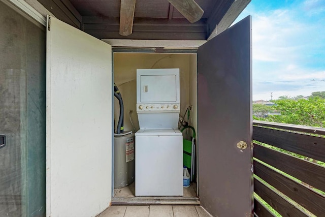 1840 Burton Dr Unit 102, Austin, TX 78741 - laundry area with stacked washer / drying machine and light tile patterned flooring