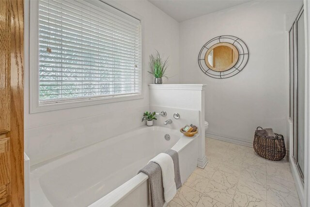 1110 County Road 439, Dime Box, TX 77853 - bathroom with marble finish flooring, a garden tub, and a shower stall